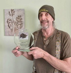 Founder of Severn Otter Group accepting a UKWOT Award 